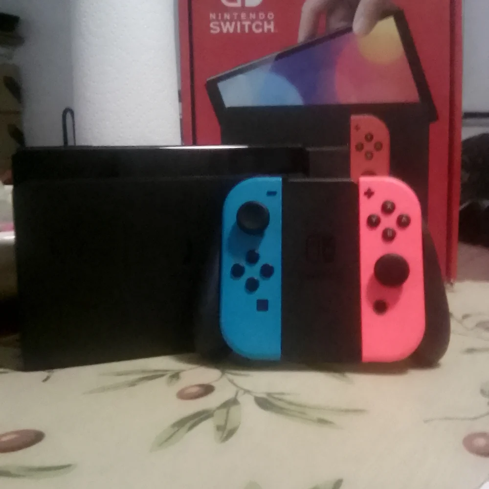 Nintendo Switch Console with Vivid Blue and Neon Red Joy-Cons